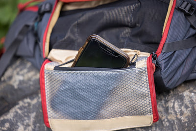 EVOC Hip Pack Pro showing storage pocket with cell phone