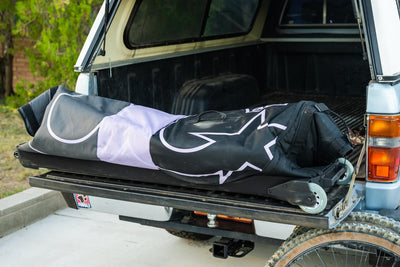 EVOC Bike Travel Bag Pro image folded up on truck tailgate from The Radavist review