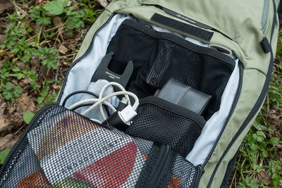 EVOC Stage 6L Backpack open revealing organizing pockets inside as portrayed in Freehub Magazine product review