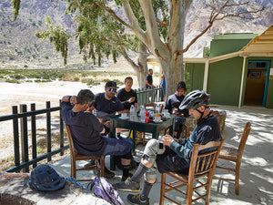 Mountain bikers with EVOC gear eating lunch