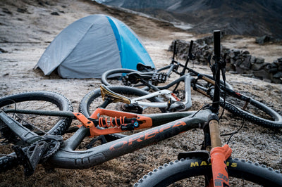 Bikes covered in frost lying outside tent