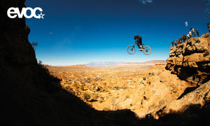 Mountain biker jumping off cliff in the Utah desert